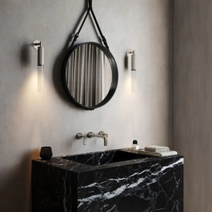 Reeded Glass and Brass Cylindrical Wall Light nickel finish in a bathroom