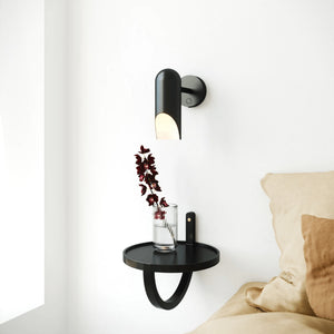 Minimalist Adjustable Black Metal Wall Light next to a bed