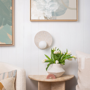 Terrazzo Artificial Stone Disc Wall Light in a modern and retro living room next to a sofa