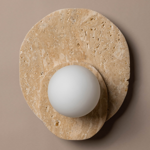 Dual Travertine Disc Wall Light on a beige wall