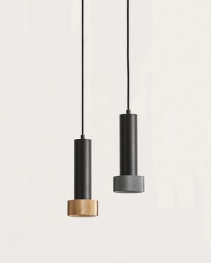 Two pendant lights with black and gold finishes on a light gray background