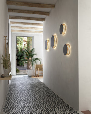 Circular Beige Cotton Thread Wall Light on a patio