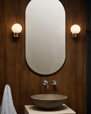 Bathroom Orb Wall Light with chrome Wall Bracket on a timber bathroom wall