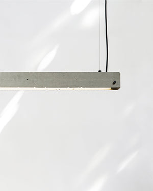 Modern pendant light fixture on a white background