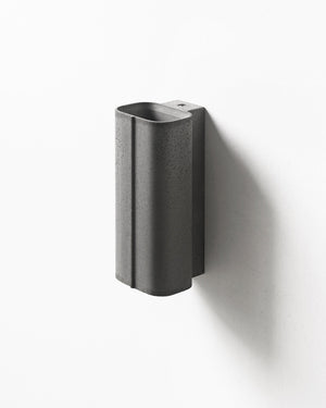 Gray wall-mounted light fixture on a white background