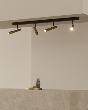 Modern ceiling light fixture with three lights on a neutral background