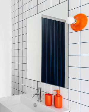 Curved Wall or Ceiling Light | Teti Lighting Collective Orange In a Bathroom