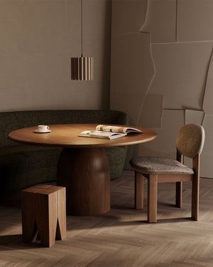 Dining area with wooden table, chair, and bench in a modern interior setting Cylindrical Pleated Ceramic Pendant Light 