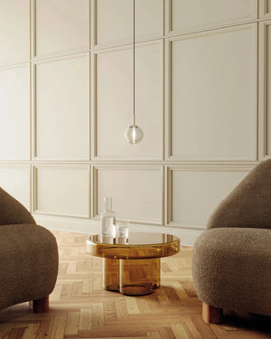 Delicate Ridged Glass Spherical Pendant in a modern living room |  Lighting Collective 