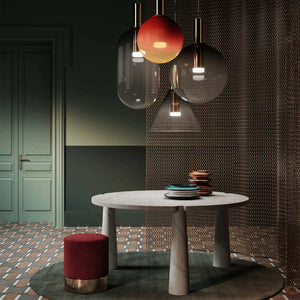 Hand-Blown Crystal Capsule Suspension together with sphere and conical shapes over a dining table