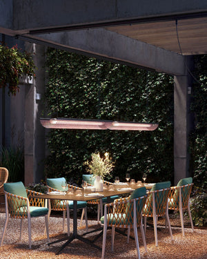 Exterior Linear Pendant Track Light in Red above exterior dining table