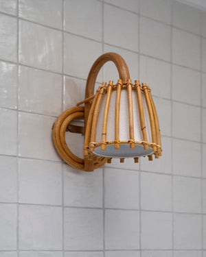 Bamboo wall sconce on a tiled wall