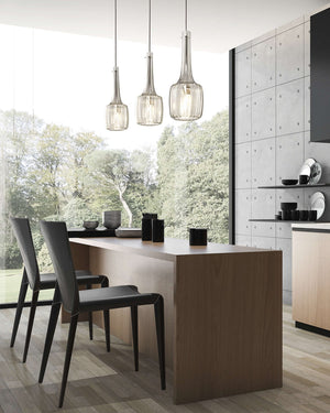 Modern kitchen with wooden island and blown glass pendants