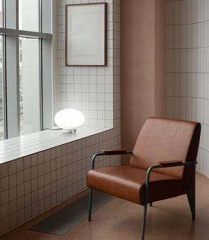 Ovate glass table lamp with a frosted white glass and chrome base