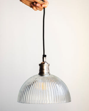  A vintage style ribbed glass pendant light with an antiqued silver metalware  and black cable