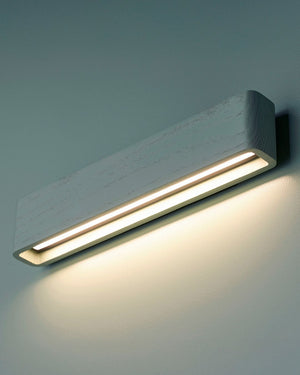 Rectangular timber sconce with blue finish on blue background