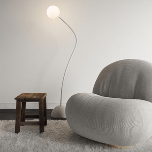 Minimalist Flexible Arm and Orb Floor Lamp | Lighting Collective | in a reading nook