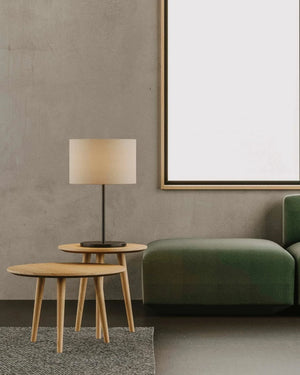 Modern living room with a green sofa, wooden side tables, and a Minimalist Marble Table Lamp