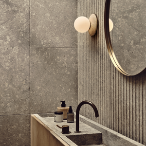 Natural Stone Orb Wall Light | Lighting Collective | travertine in a bathroom