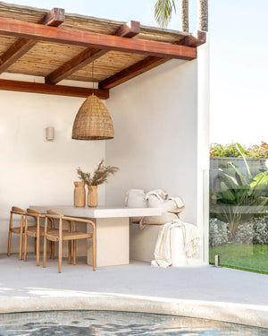 Natural Rattan Folk Pendant Light | Lighting Collective | Pendant Above Outside Dining Table