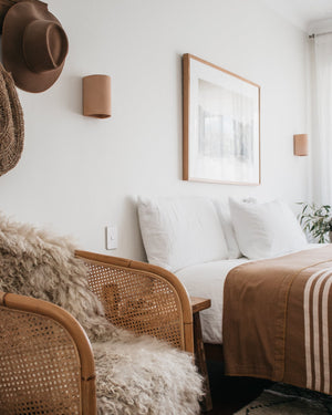 Organic Raw Ceramic Wall Light | Nudie In a bedroom
