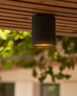Ribbed Exterior Ceiling Light installed on wooden ceiling | Lighting Collective 