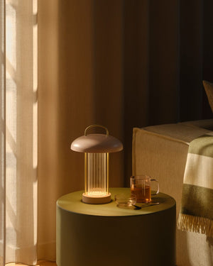 Portable Fluted Glass Table Lamp in Dusty Pink on side table