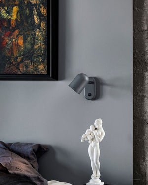 Wall-mounted Scandinavian Designer Wall Light with abstract painting and sculpture on a gray wall