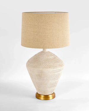 Textured Concrete Table Lamp beige textured shade and base on a light gray background | Lighting Collective