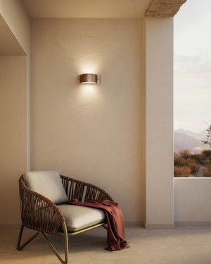 Curved metal wall light on facade