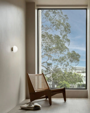 Architectural Glass Dome Wall Sconce Styled in a Minimalist Apartment