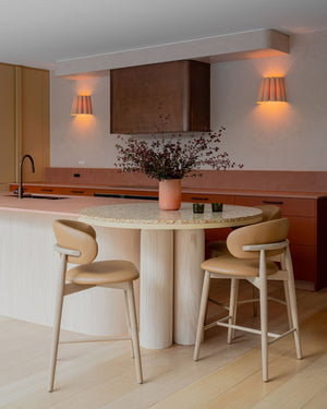 Pleated wood wall light in a warm style kitchen
