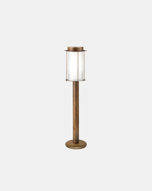 Small Brass Lantern Bollard Light with cylindrical frosted glass shade, antique brass rod frame and round disc base