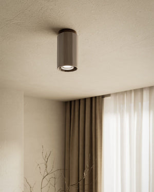 Large light grey ceiling light in a beige living room