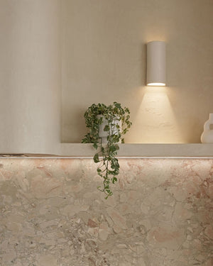 Indented ceramic wall light styled in a minimalist kitchen