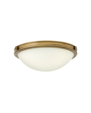 Medium Ceiling light fixture with heritage brass frame and opal glass on a white background