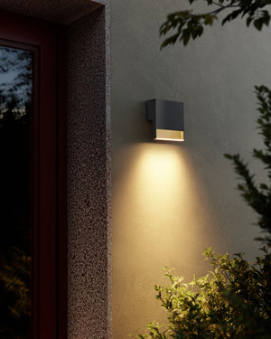 Coastal Grade Smoked Glass Stripe Wall Light against clay coloured exterior wall =