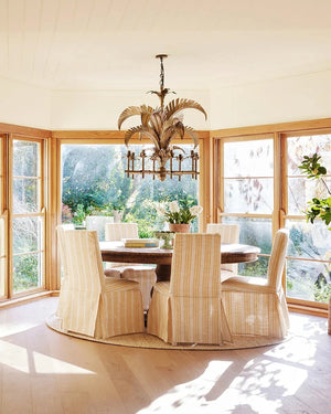 Coastal-Luxe Palm Chandelier over a dining table