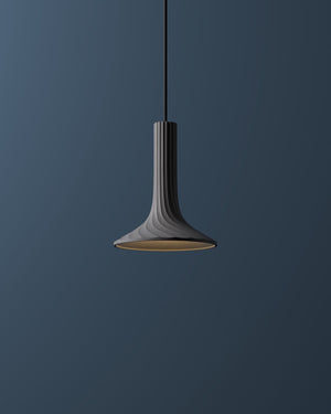 Pendant light fixture against a dark blue background