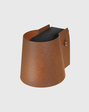 Simple up down light source with conical rust shade attached on grey background