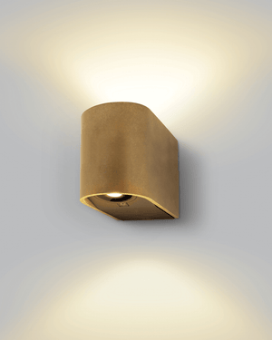 Simple up down light source with cylindrical brass shade attached