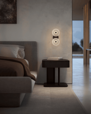 Modern bedroom with a bedside table and a Soktas Coral Duo wall light