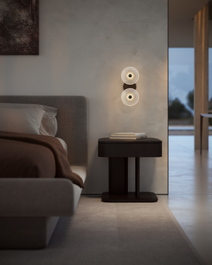 Modern bedroom with a bedside table and a Soktas Coral Duo wall light