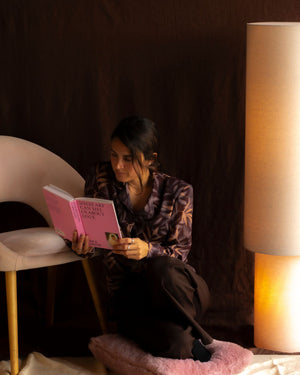 Cylindrical Linen Floor Lamp Styled in a Moody Bedroom