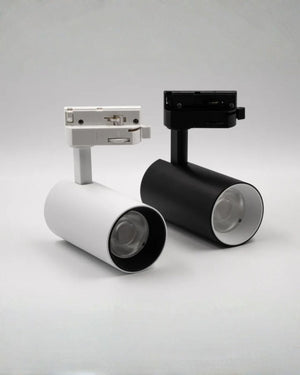 Two track lights, one white and one black, on a light gray background.
