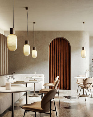 Designer Perfume Bottle Inspired Glass Pendant Light | Bloom | Bronze in a cafe