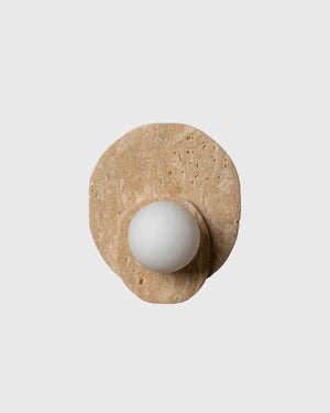 Yellow travertine wall sconce on grey background