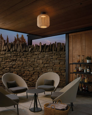 Modern outdoor seating area with stone wall and ceiling light fixture