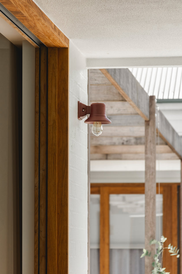 Italian ceramic wall light on a mid-century entryway - Byron Bay hinterland project by Lighting Collective 