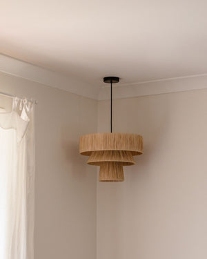 Hand-Crafted Tiered Raffia Pendant Styled in Minimalist Bedroom